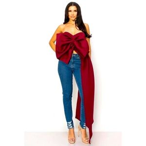 Merlot colored top with large bow and side train.